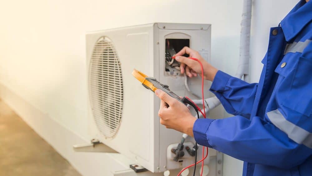 ac repair in New Jersey with technician running diagnostics