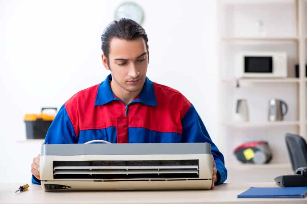 AC technician advising on AC warranties in Morristown NJ